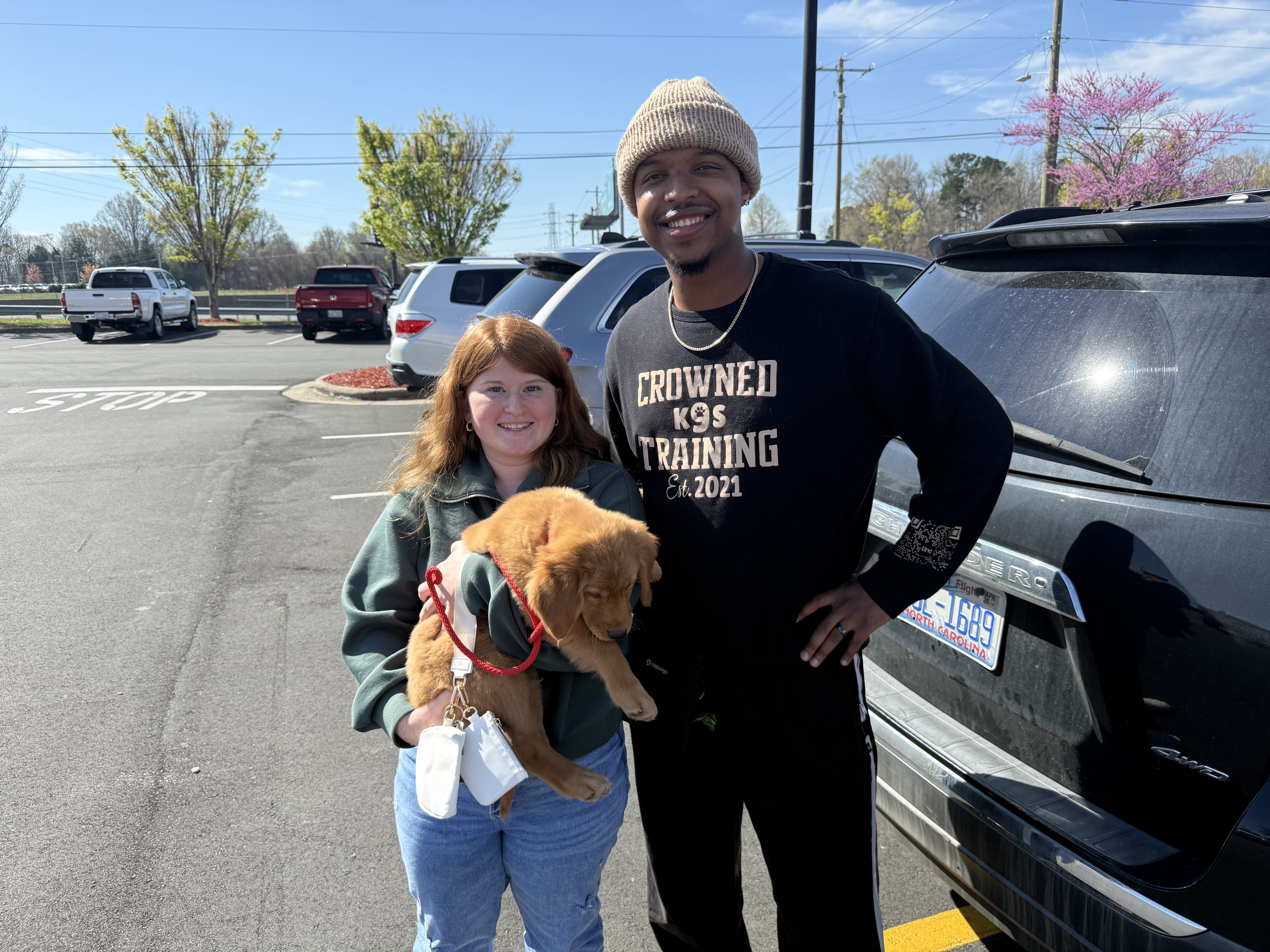 Kobe with his adopter and Crowned K9s trainer at go-home